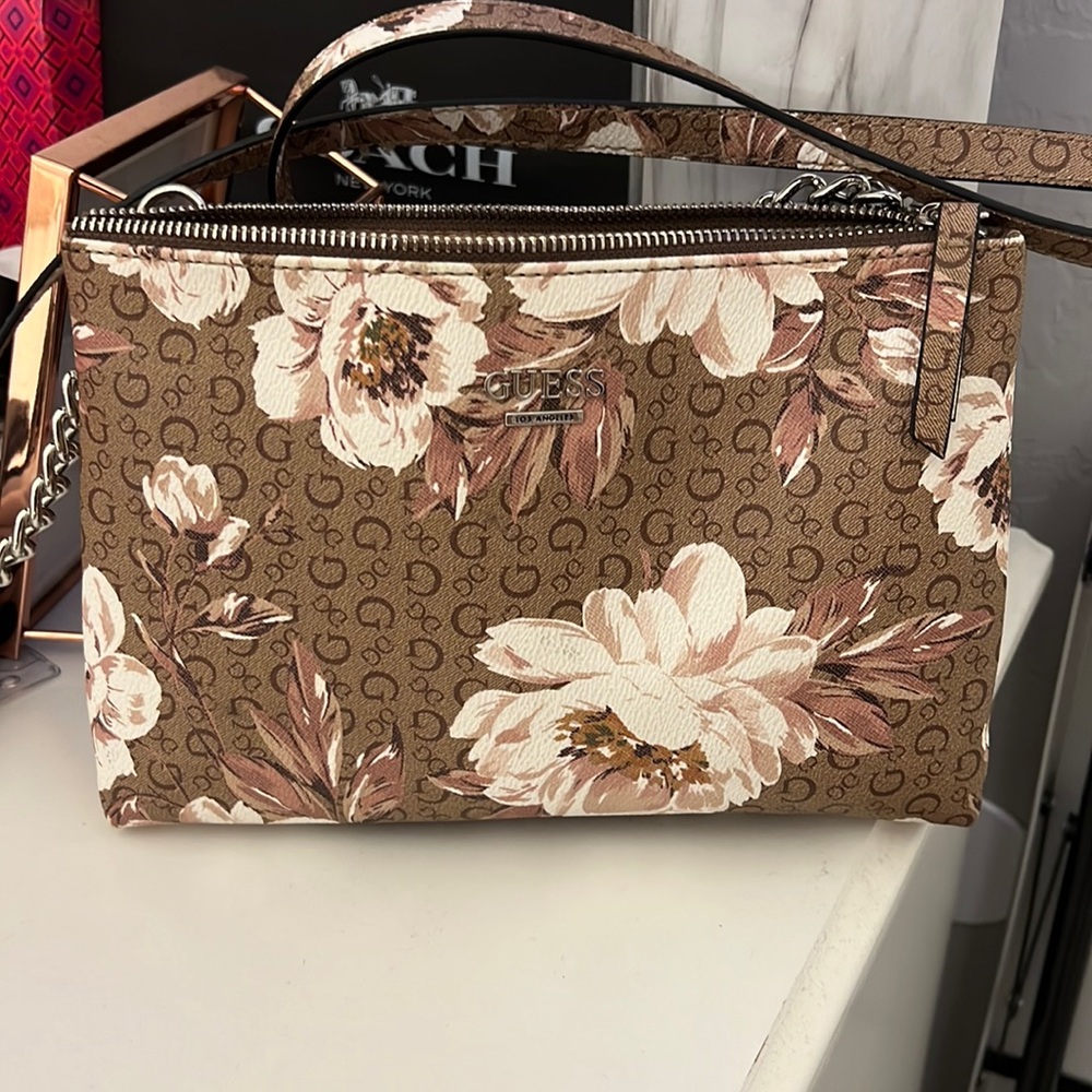 Guess bag medium bag with good space in it. 3 pockets